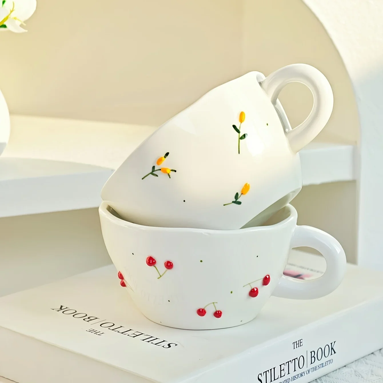 

Creative, minimalist, hand drawn, three-dimensional relief cherry blueberry, household ceramic coffee cups and plates