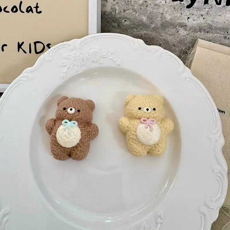 Slow-rebound bow-tie bear squeeze toy available in two colors; its compact size makes it cute and convenient to carry around.