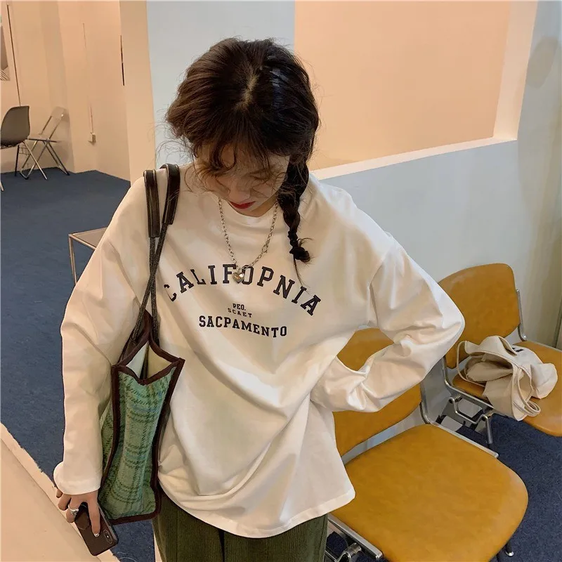 قميص نسائي فضفاض بأكمام طويلة على الطراز الكوري من القطن الخالص، قميص أساسي مع طباعة حروف، أنيق وعملي متعدد الاستخدامات