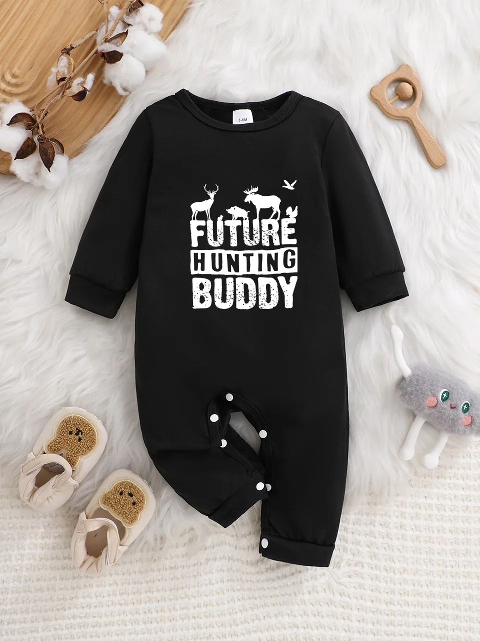 A baby long-sleeved onesie with interesting letter prints. It features a buttoned design for easy putting on and taking off
