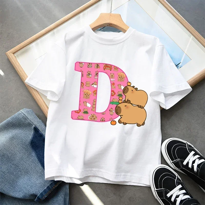 2026 Cute Cartoon Capybara Kids T-Shirt Cotton Short Sleeve A-Z Letter Print Summer Top for Girls Child Fashion Gift Item