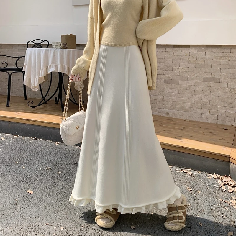 2025 한국 버전 가을 겨울 신축성 있는 허리 플리츠 스커트 하프 스커트 슬림 스커트 페어리 솔리드 심플 오피스 니트 A라인