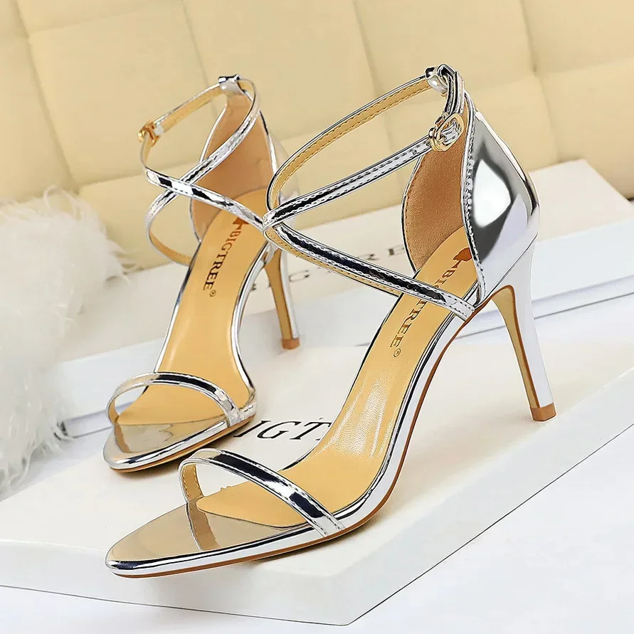 

European and American style fashion sexy nightclub open-toed metal feeling cross strap stiletto sandals women's high heels