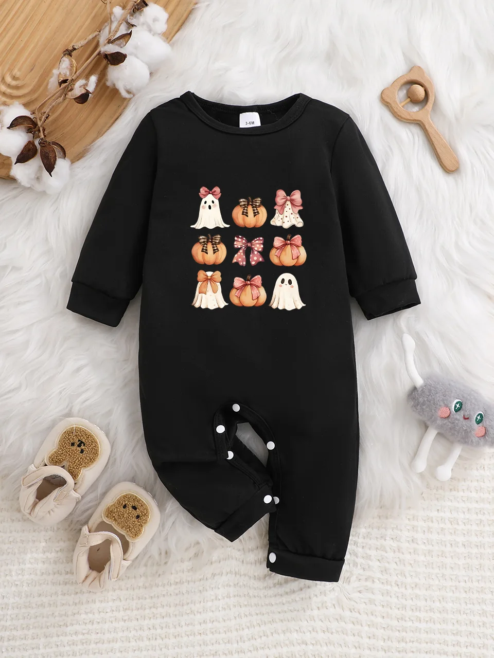 A baby long-sleeved onesie with interesting letter prints. It features a buttoned design for easy putting on and taking off, and