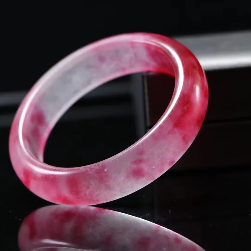 Peach-colored , translucent quartz rock jade with red patterns, medium-width jadeite bracelet