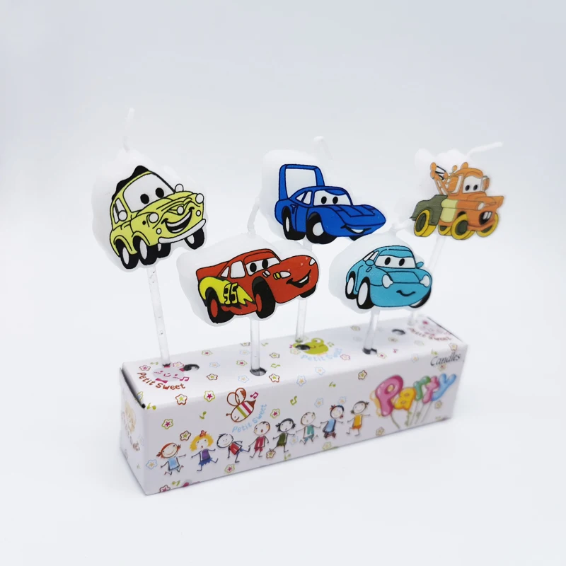 Car with smiling face, birthday candles, cartoon cake decoration