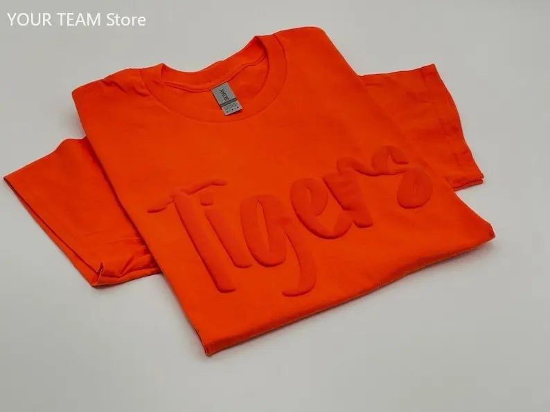 

Custom Puff Print Team Name T-shirt Personalized Puff Writing For Companies Embossed Mascot Shirt Puff Print School Sports