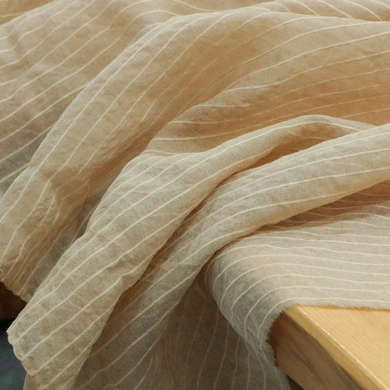 This is a niche designer fabric made of silk satin and gossamer with dirty dyeing techniques