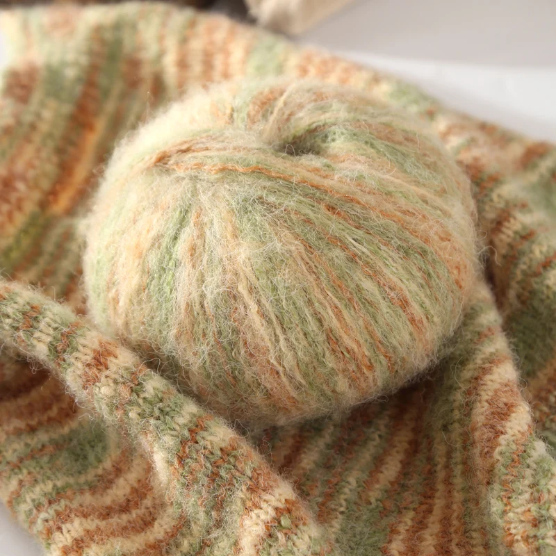 300gGradient-colored yarns made from mohair with a fuzzy texture, showcasing a vibrant array of colorsCreating sweaters, scarves