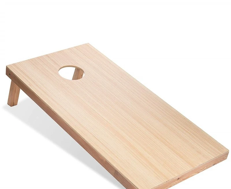 Children throw sandbags, throw target game boards, leisure outdoor sports processing wooden sandbags