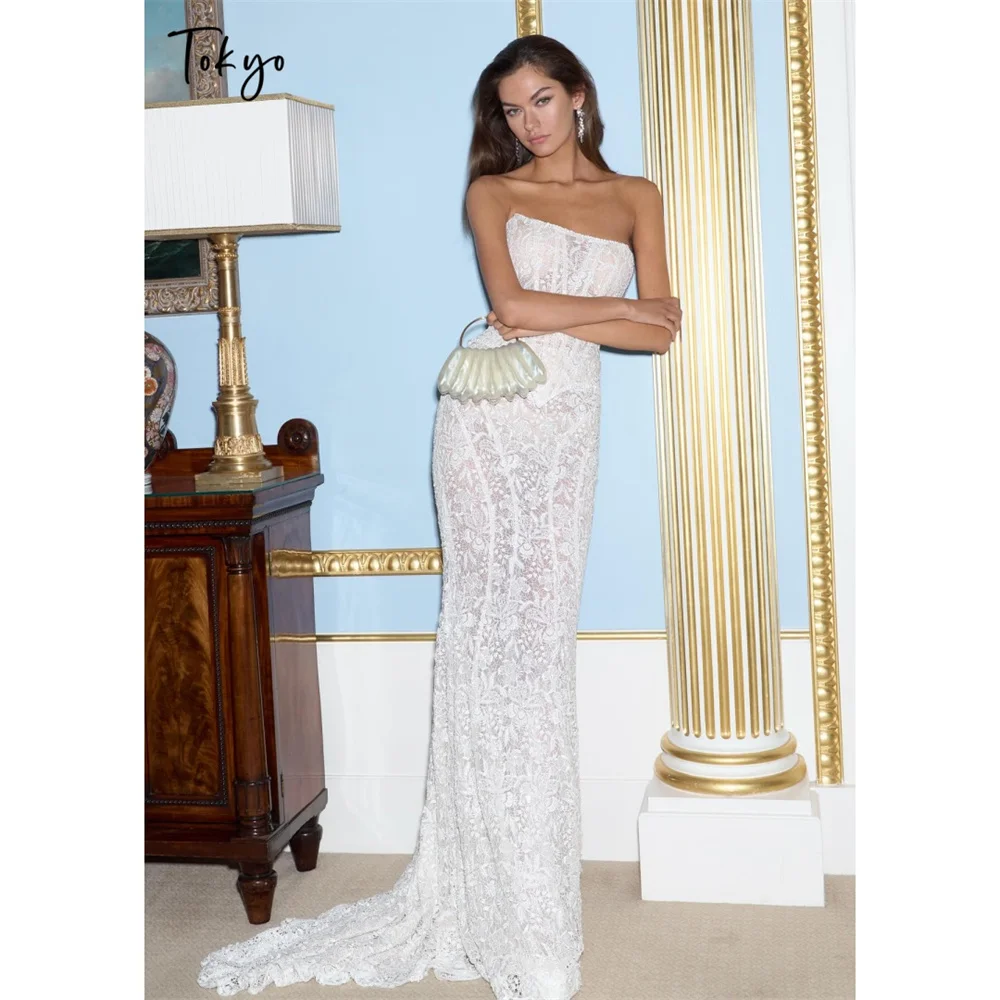 طوكيو فساتين زفاف بيضاء مخصصة بدون حمالات بدون أكمام من الخلف برباط علوي زي العرائس 2025 حورية البحر ذيل محكمة فساتين الزفاف