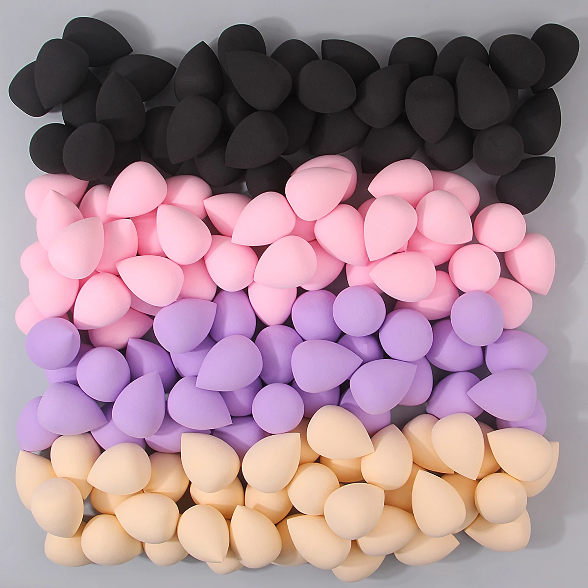 100 SZTUK super miękkich, dużych gąbek do makijażu, jajko kosmetyczne, narzędzie do makijażu, które rozszerza się po nawilżeniu, bez przyklejania się pudru.