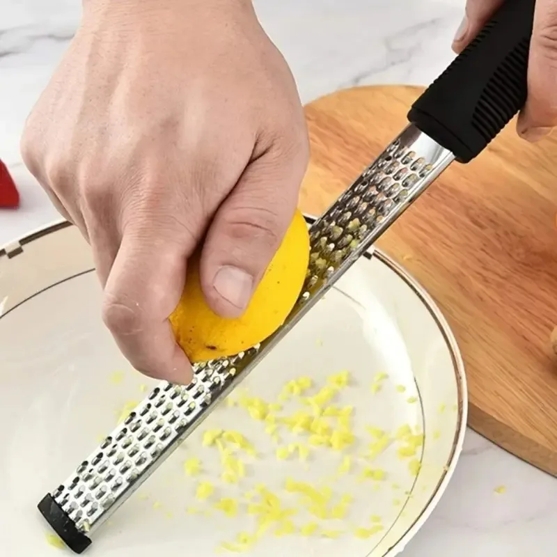 

Stainless Steel Zester Grater - Cheese & Chocolate Shaver Tool for Lemon Zest, Nutmeg & Spices kitchen accessories