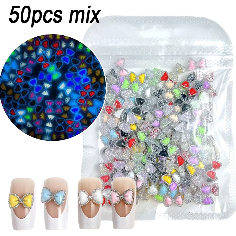 50 個発光カラフルなグリッターちょう結びネイルラインストーンスパークリングボウ樹脂ネイルチャーム 12*7 ミリメートルフラットバックボウタイネイル用品 E3