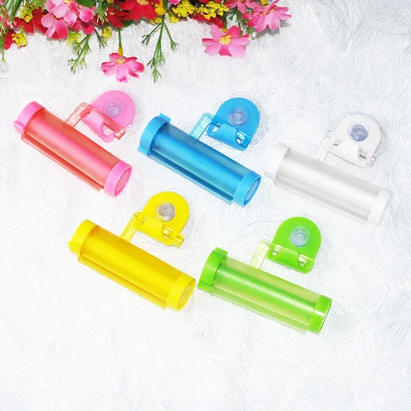 1Pcs New Easy Squeezer Toothpaste Roller Tube Rack Dispenser Rolling Holder Easy Squeeze Paste Dispenser Roll Holder Hanging