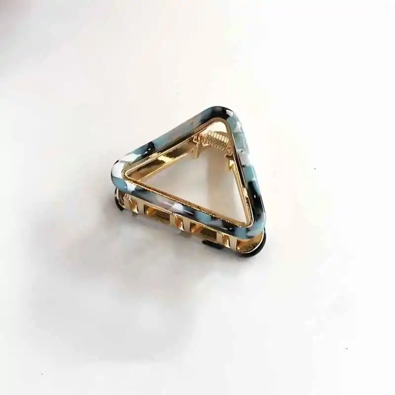 

FEMALE HAIR CLIP IN THE SHAPE OF CAT EARS AND TRIANGLE MADE OF ACETATE MATERIAL WITH METALFOR THE BACK OF THE HEAD