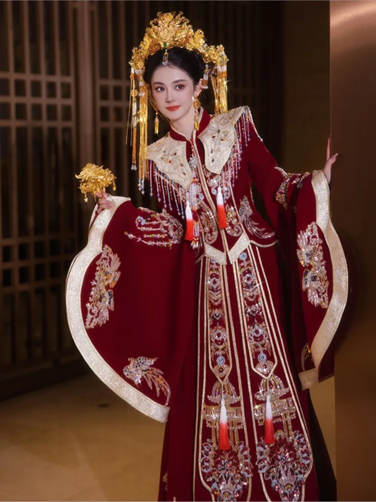 

The wears a traditional Chinese wedding dress with phoenix crown and red veil made of heavy velvet