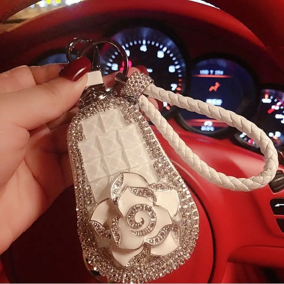 Universal rhinestone car key bag car key protective sleeve men and women pendant leather hair ball rope creative personality bag