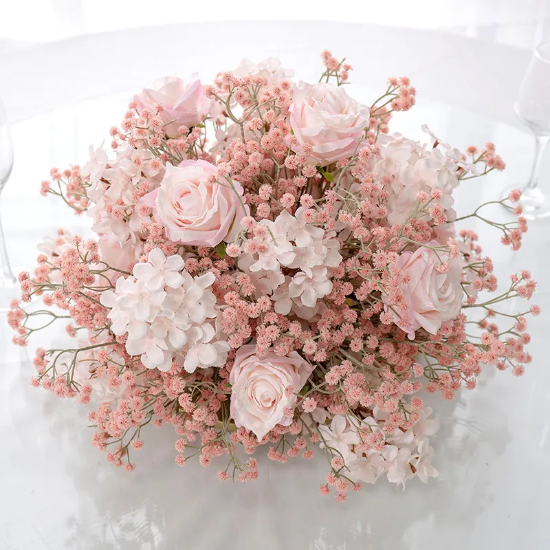 Hotel wedding banquet table with gypsy roses and table flowers, fake flower decoration