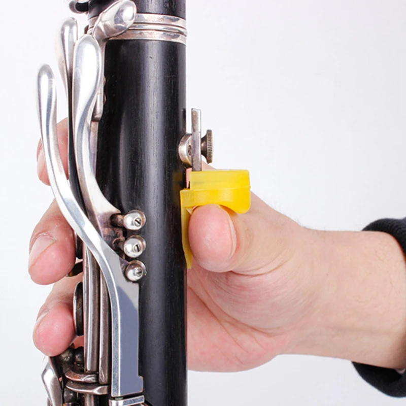 Confezione da 5 clarinetto in Silicone morbido cuscino per poggiapolsi per pollice protezione per pollice per strumento a fiato 5 colori