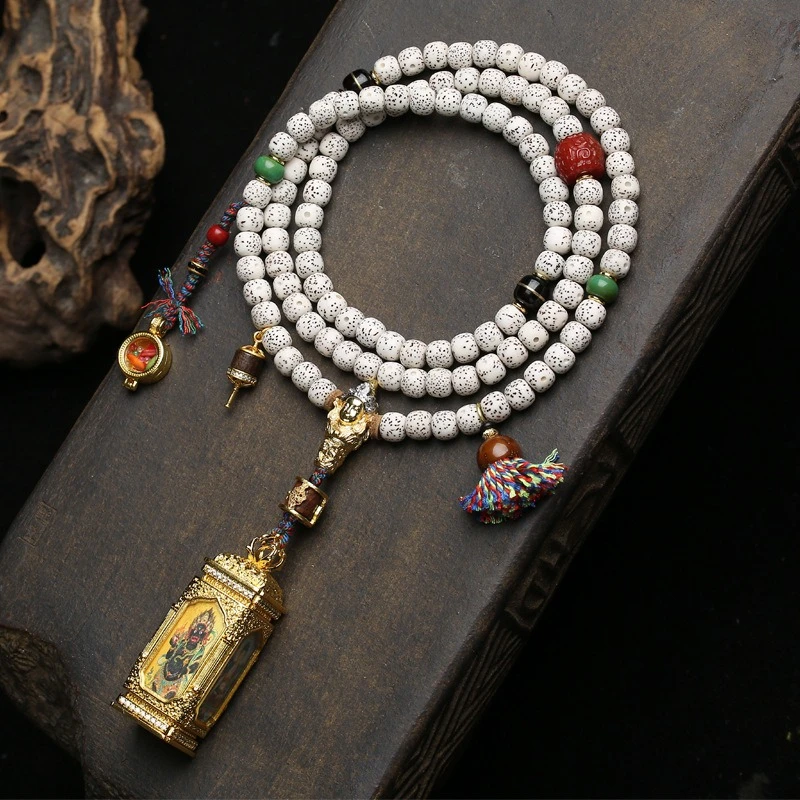 

108-bead natural star-and-moon bodhi seed rosary, with a small four-sided Thangka pendant, agate and gawo box accessories