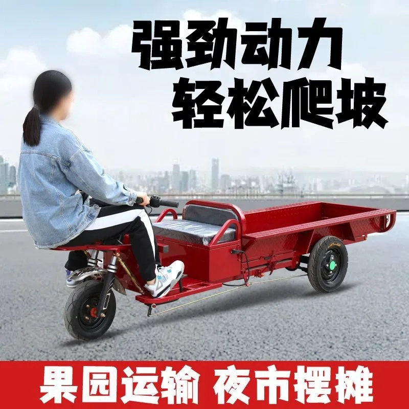 The transport vehicle has a low chassis and is riding upside down, an electric tricycle for night market stalls