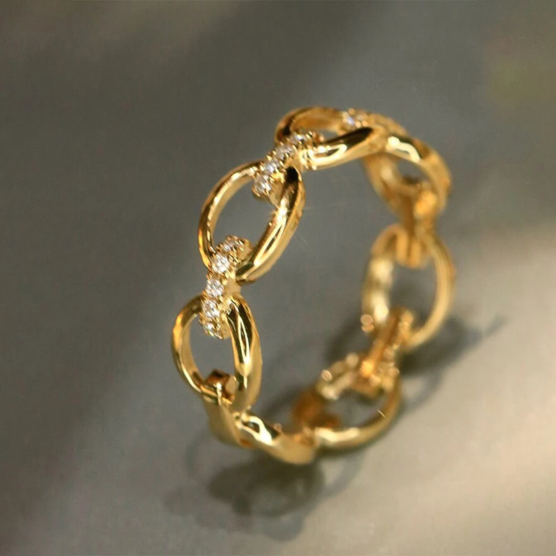 Huitan Damenring, goldfarben, Kettendesign, eingelegt mit hellem Zirkonia, modisches Hochzeits- und Party-Accessoire, luxuriöser Alltagsschmuck