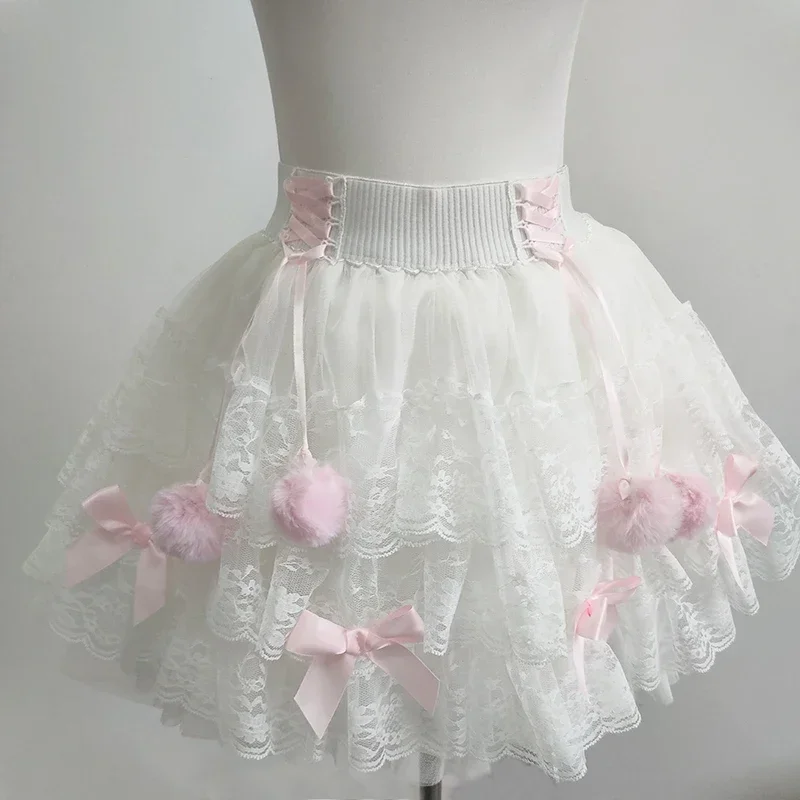 Simpatiche gonne di pizzo multistrato per ragazze dolci Decorazione di fiocchi estivi Vita elastica Gonna bianca stile Lolita Abiti Kawaii