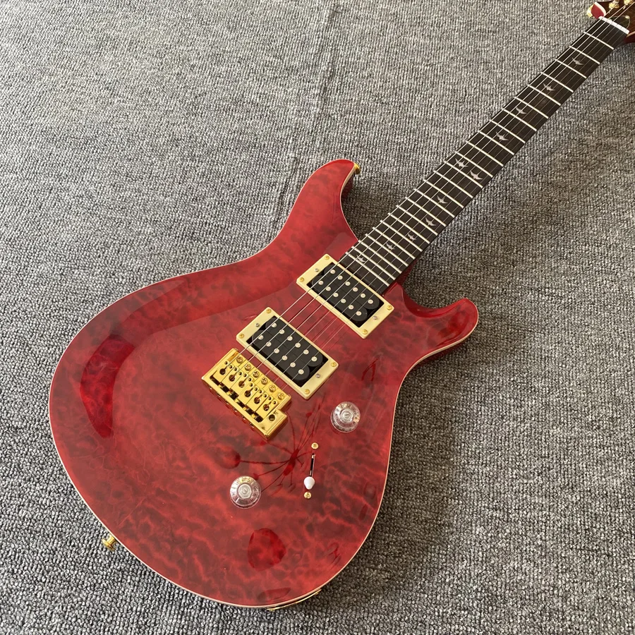 High quality electric guitar, wine red floral finish, rosewood fingerboard, gold hardware, vibrato system, 2 pickups