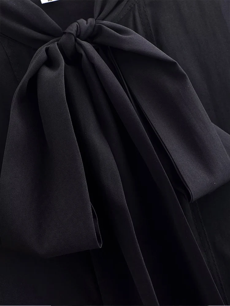 European style new women's fashion versatile elegant solid color long-sleeved shirt with bow detail and round neckline.