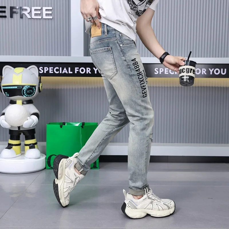 Ripped print jeans men's street fashion high-end fashion design leisure slim-fitting small straight stretch pants