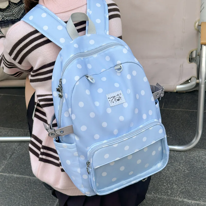 Korean-style polka dot backpack for girls, a stylish and high-quality bag for female students, featuring a large capacity, light