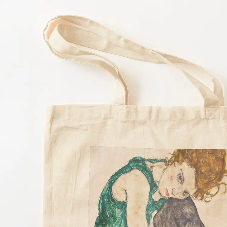 Egon Schiele - Seated Woman with Legs Drawn Up (Adele Herms) (Sitzende Frau mit angezogenem Knie) 1917 Tote Bag