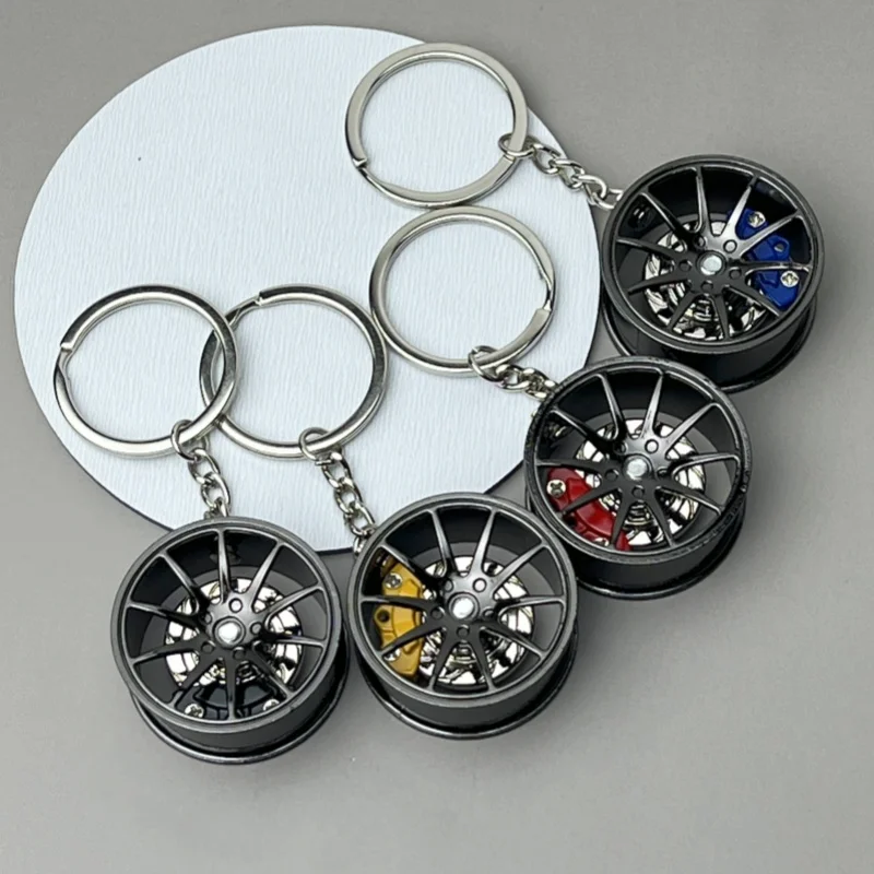 

New 2024 automobile wheel hub fashionable keychain pendant tire pendant metal pendant men's and women's gift Decompression toy