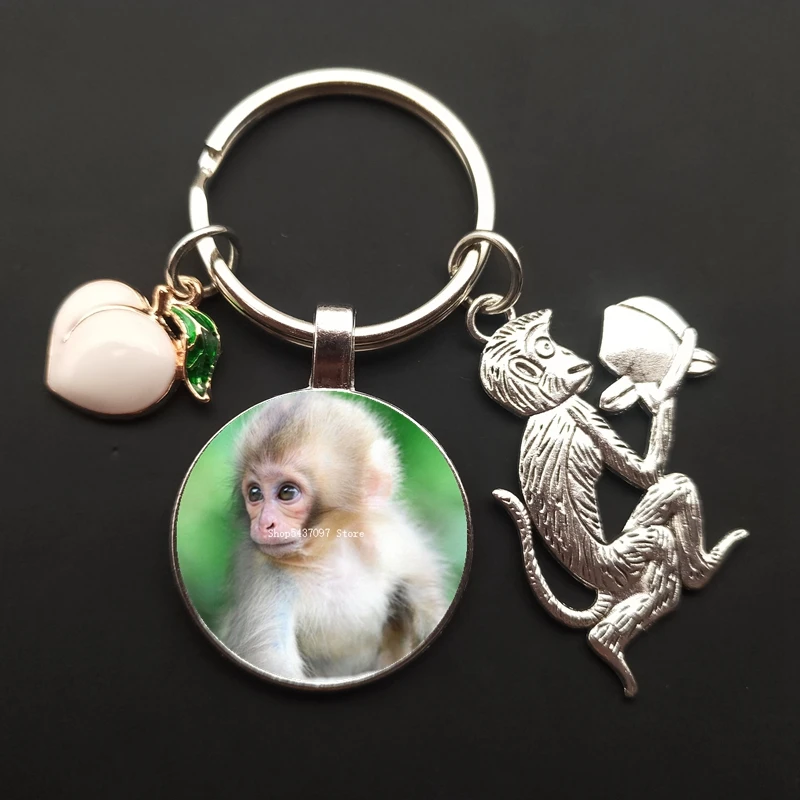 Monkey charm keychain monkey painted glass cabochon car bag ornaments peach keychain men and women souvenirs