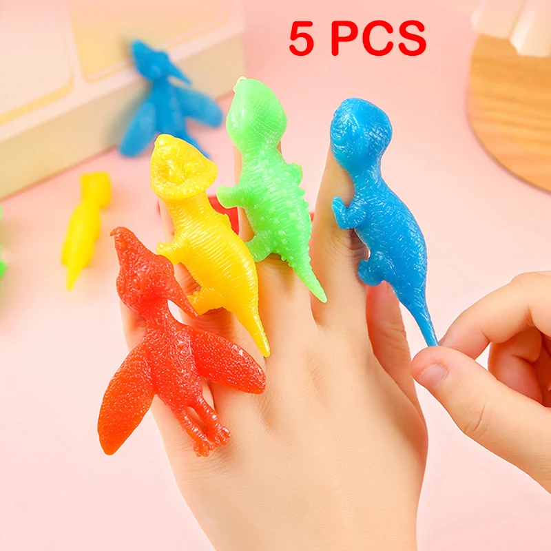 5Pcs Creative Finger Slingshot Dinosaur Stress Relief Toys Novelty Funny Slingshot Dinosaur Lala Le Halloween Prank Toys