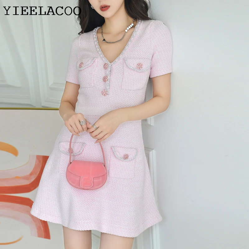 Women's knitted dress V-neck 2023 early autumn new pink small fragrance waist up commuting French style reduced age short dress