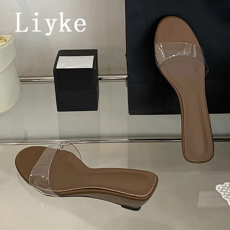 

Liyke 2025 новые модные тапочки на танкетке с открытым носком, женские шлепанцы на низком каблуке, прозрачные сандалии, женская пляжная обувь для вечеринок, размер 40