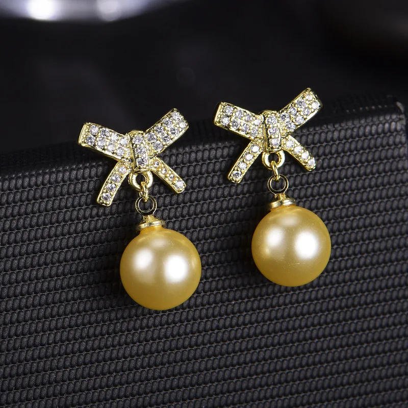Korean-style realistic imitation natural freshwater pearl with full diamonds and bow-shaped earrings for sensitive ears - women'