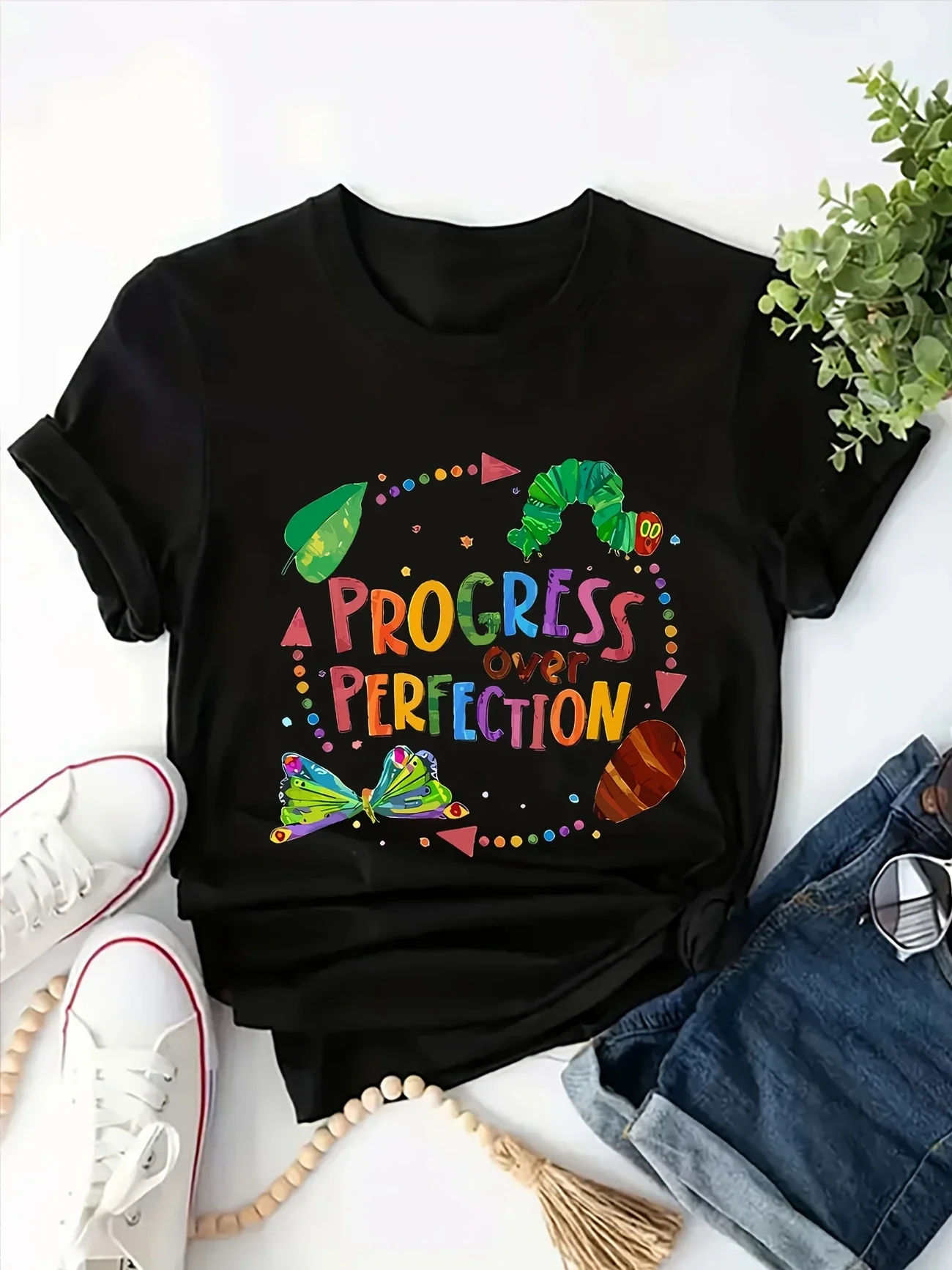 

Plus - Size cartoon classic graphic T-shirt with short sleeves and "Progress over Perfection" print