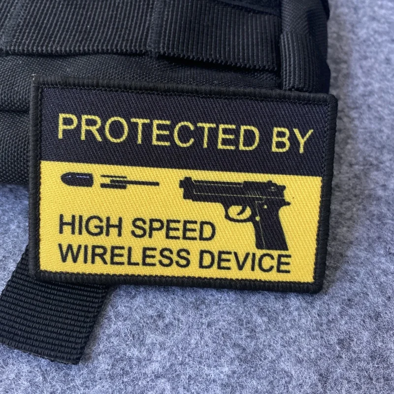 PROTECTED BY HIGH SPEED WIRELESS DEVICE Morale Badge Patch Hook and Loop Pistol Fires Bullets Outdoor Backpack Tactical Sticker