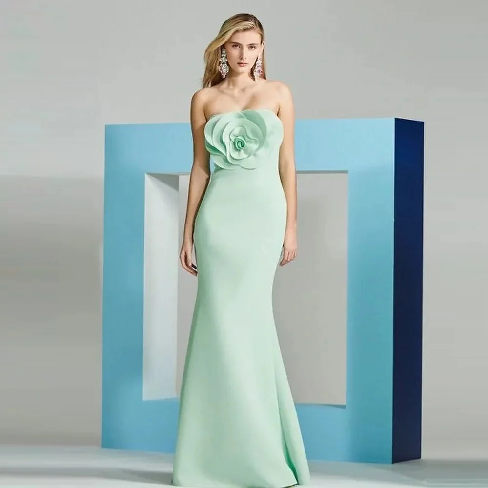 

Customized strapless floor-length gown with skin-flattering fresh hue, floral decor on chest and waist cincher to shape figure e