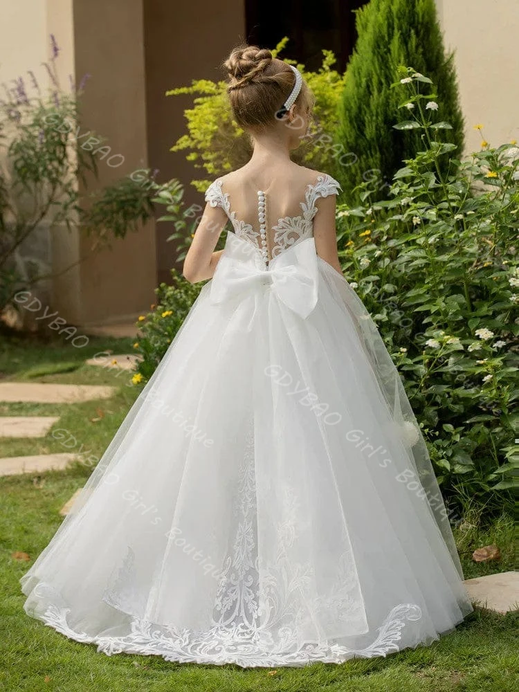 فستان زفاف صغير أبيض على شكل حرف a/أميرة للفتيات على شكل زهرة ورقبة شفافة من الدانتيل تول فستان التواصل الأول مع فيونكة مخصصة