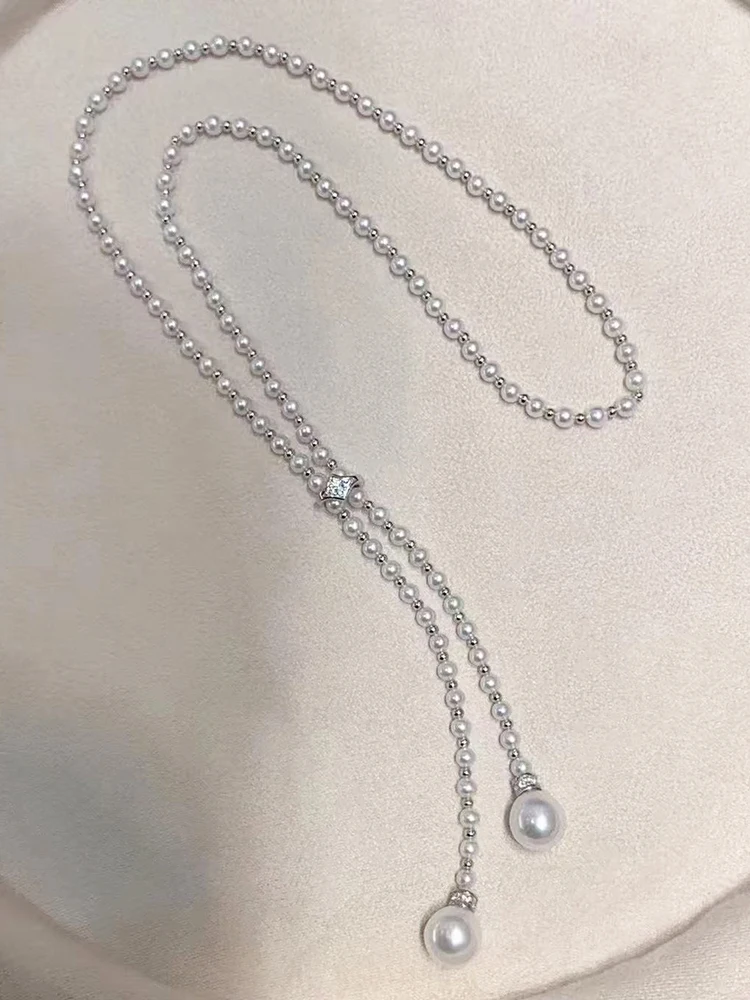 

Дизайнерская цепочка для свитера длиной 60 см с пресноводной Акойя Авроры диаметром 4-5 мм, большой белый жемчуг 10–11 мм и регулируемой застежкой из серебра 925 пробы