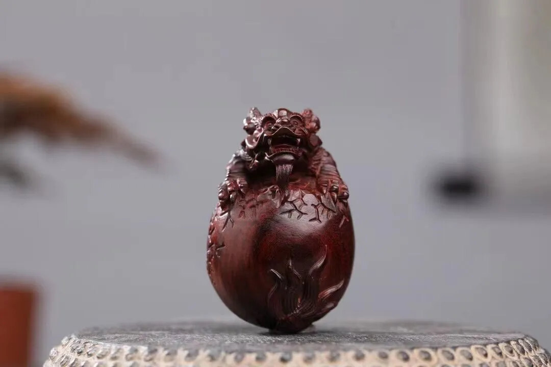 

Indian Lobular Red Sandalwood Wood Hand Carved Dragon Egg Statue