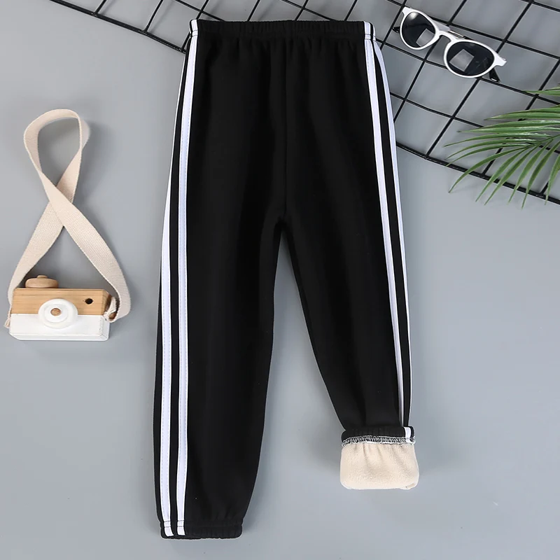 Autumn and winter children\'s solid color sports plus velvet pants boys and girls comfortable leisure warm sports fashion pants.