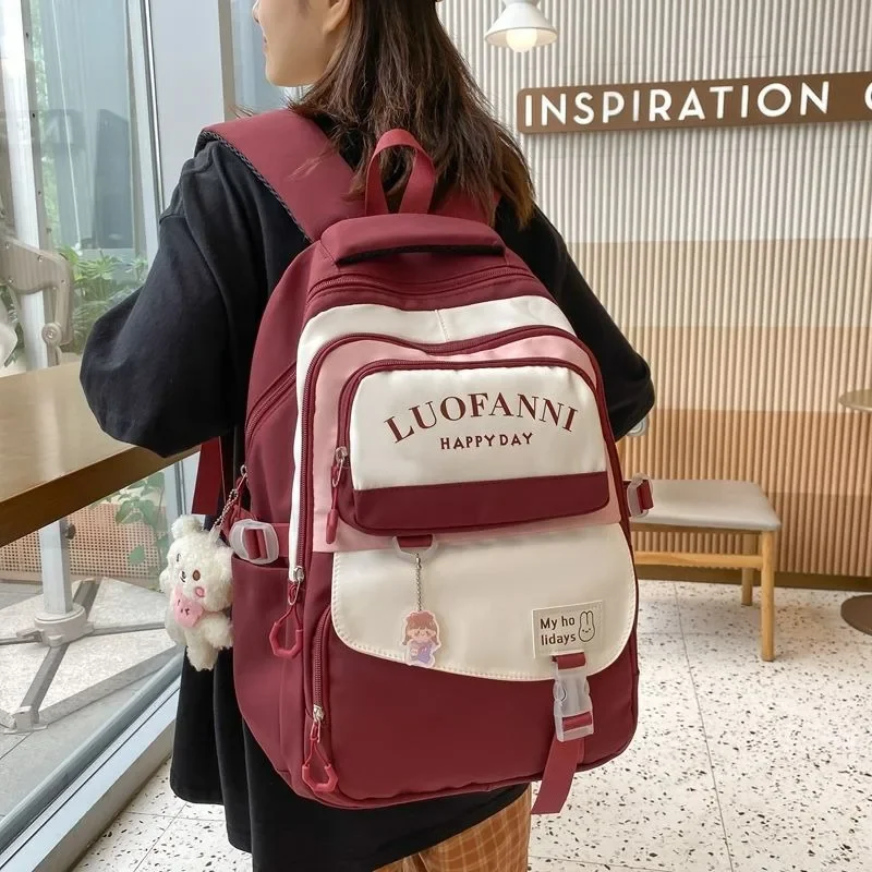 junior high school students schoolbag Female Korean version campus omnibus load reduction backpack big capacity laptop bagpack