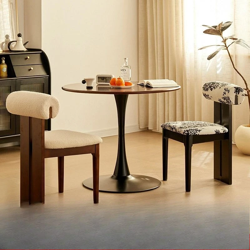 

Nordic solid wood walnut color dining table, light luxury balcony leisure negotiation tulip round table chair, small apartme