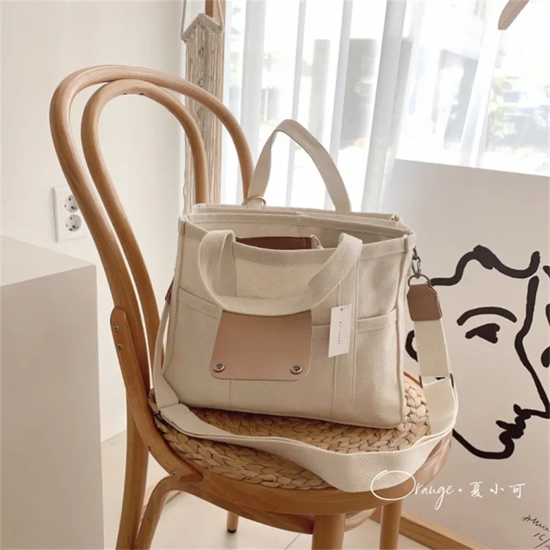 

Mommy Bag Fashionable Multifunctional and Convenient One-shoulder Crossbody Handheld Canvas Mother and Baby Stroller Hanging Bag