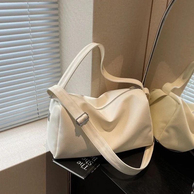 

Elegant Women's Shoulder Bag Made Of High-Quality Leather, Crossbody Convertible Feature, Popular Designer Touch